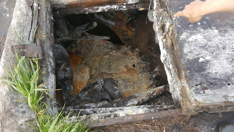 The entrance to an ice cellar that flooded in Point Hope. Photo: Ianjon Brower